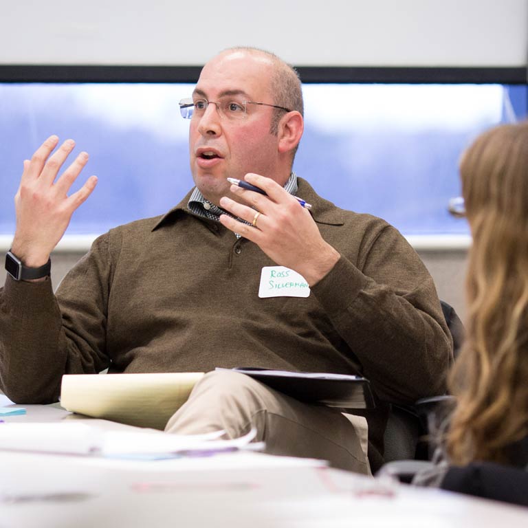 A person gestures with their hands and talks.